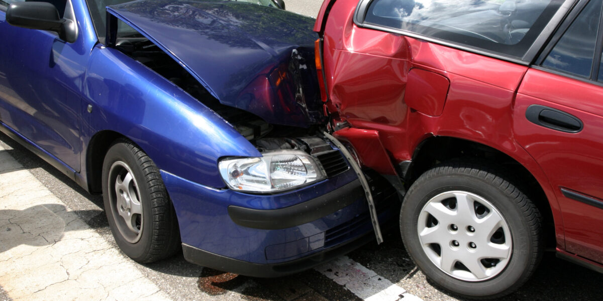 car accident with a red and blue car