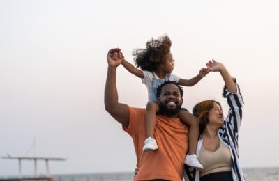 portrait of happy young black family smiling