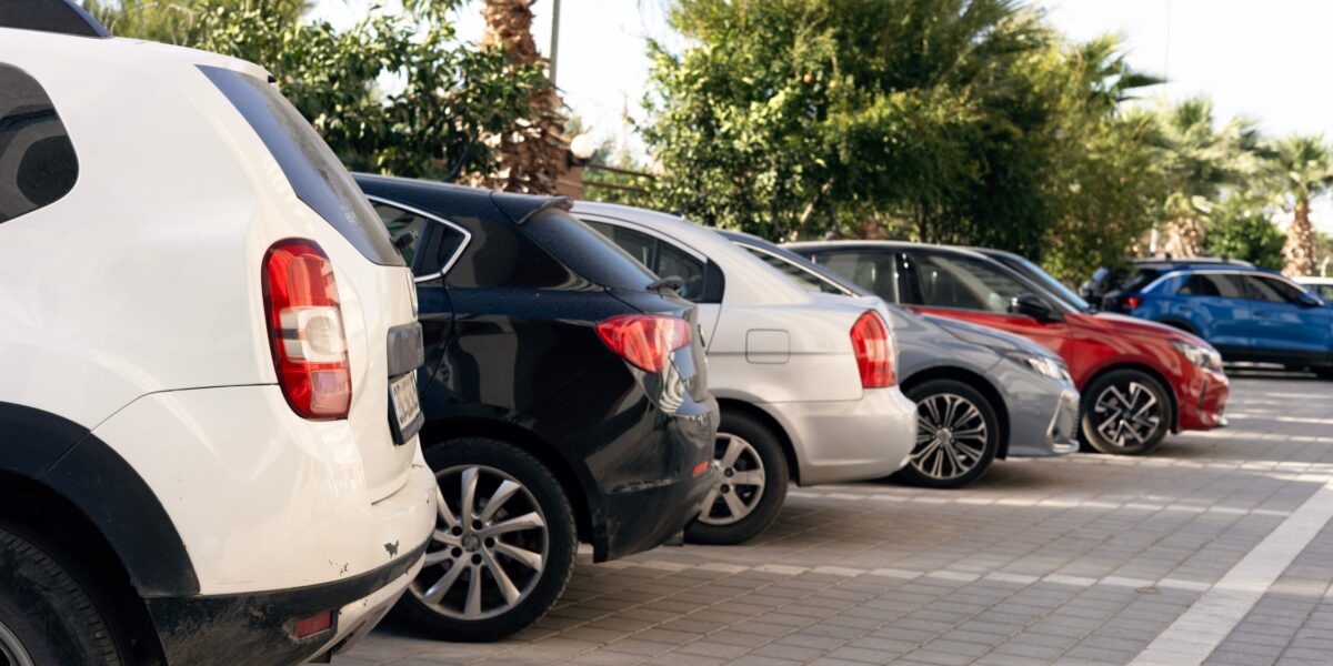 a row of vehicles in a parking lot