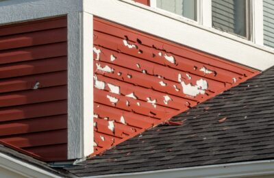 close up of building exterior with damaged siding